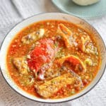 Okro Soup in a shallow white bowl with a blue rim