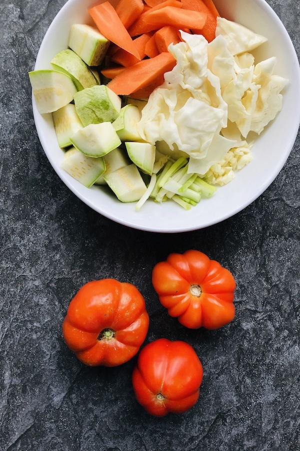 Zucchinis, carrots, cabbage, spring onions, garlic, and tomatoes