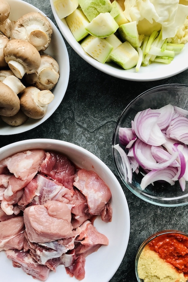 Button Mushrooms, pork sliced onions, ginger paste, chilli paste, zucchinis and spring onions