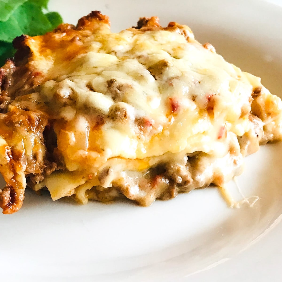 Baked lasagne on white plate