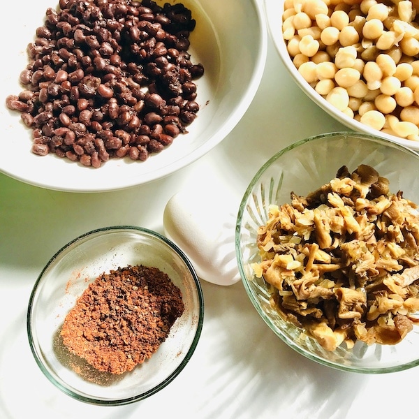 Ingredients for bean burgers-red beans, Bambara beans, spices, an egg and mushrooms