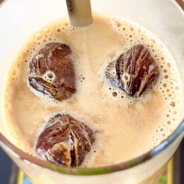 Iced coffee with three coffee ice cubes.
