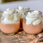 Three glass jars of homemade chocolate pudding
