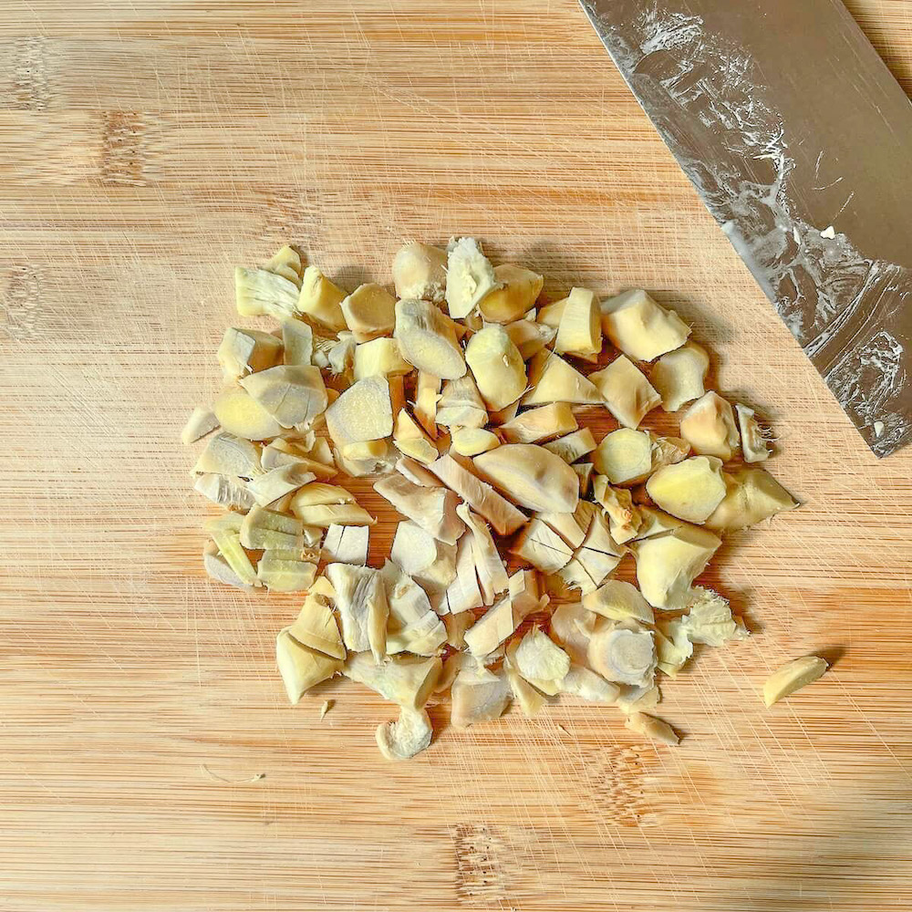 Chopped ginger on a wooden board