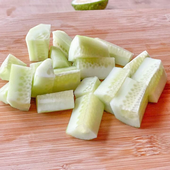 Chopped cucumbers on a wooden board