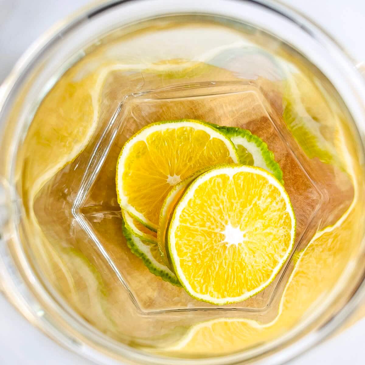 Sliced oranges in a jug
