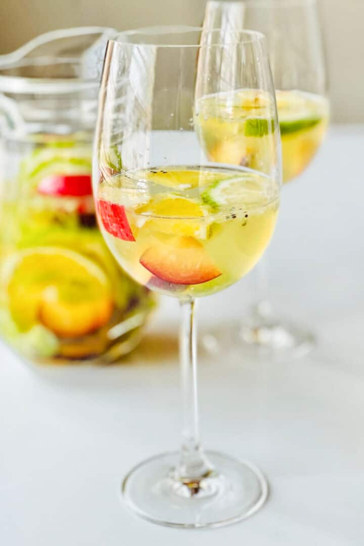 Wine glasses filled with white wine Sangria