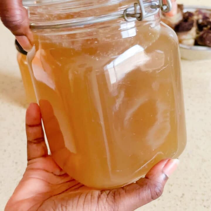 Beef stock in a glass jar.