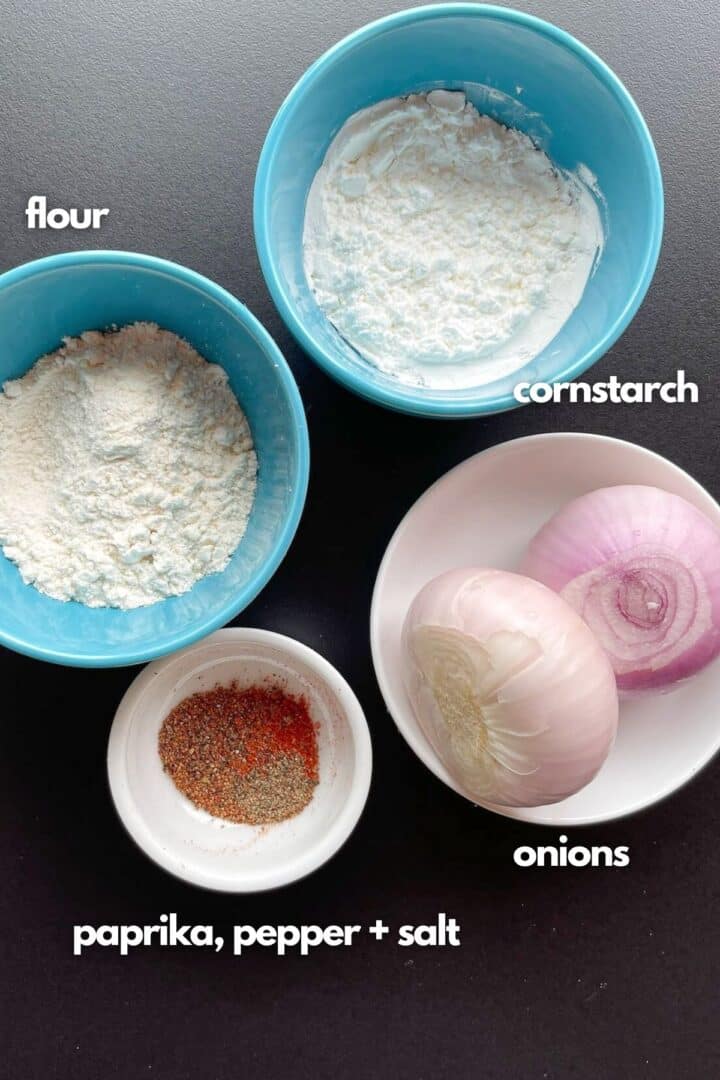 Ingredients for fried crispy onions: flour, cornstarch, mixed seasoning and two onions.