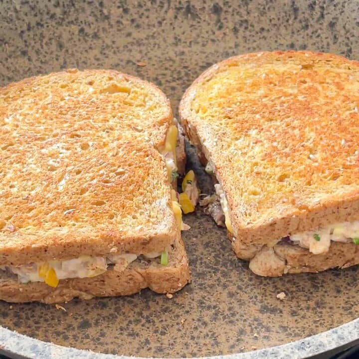 2 toasted tuna melt in a mottled pan.